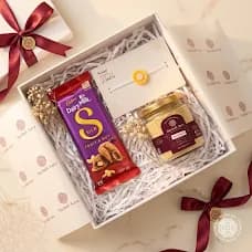 Open box of nine, overhead, ribbon loose