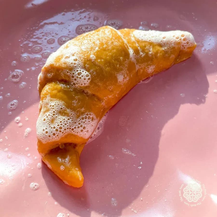 Croissant on brown paper